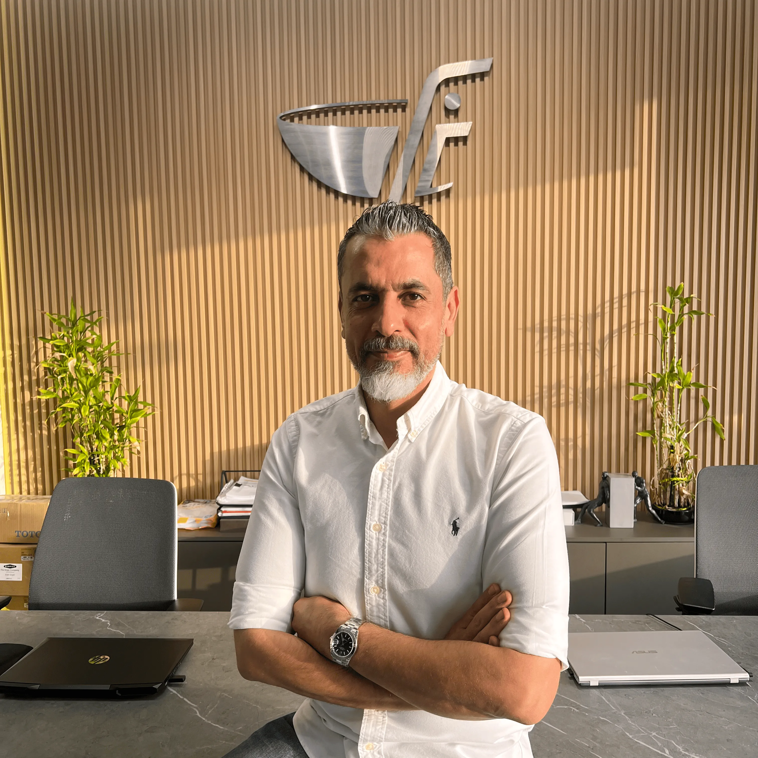 Mr Farajallah with FC logo in the background